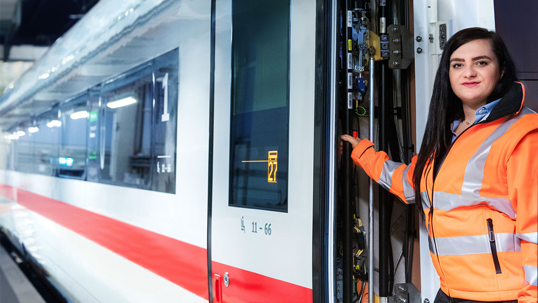DB-female-locksmith-checking-the-door-mechanism-on-a-DB-ICE-train