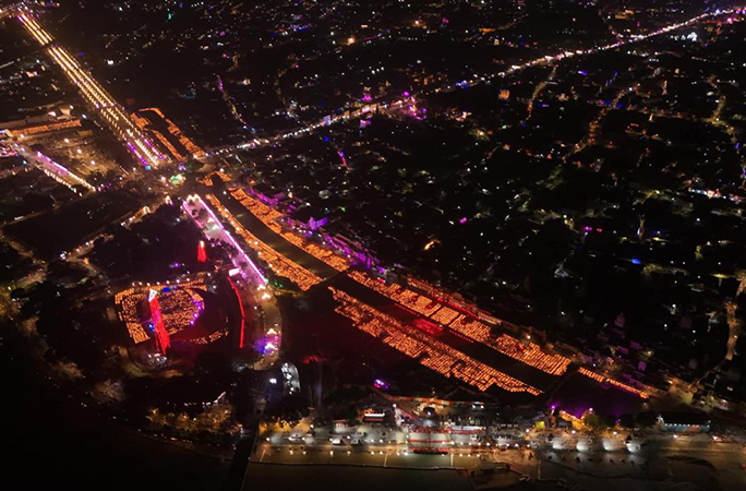 aerial view of largest display of oil lamps lit on the river banks
