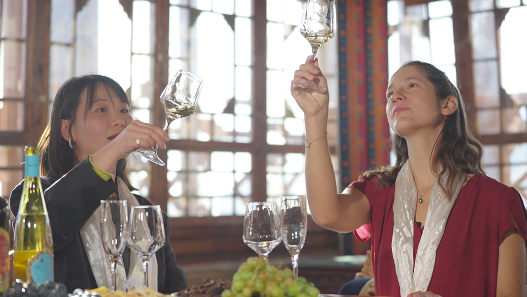 Anouk and Ms Yuan, a professional sommelier, sampling wine