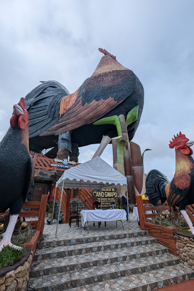 The entrance to the largest building in the shape of a chicken