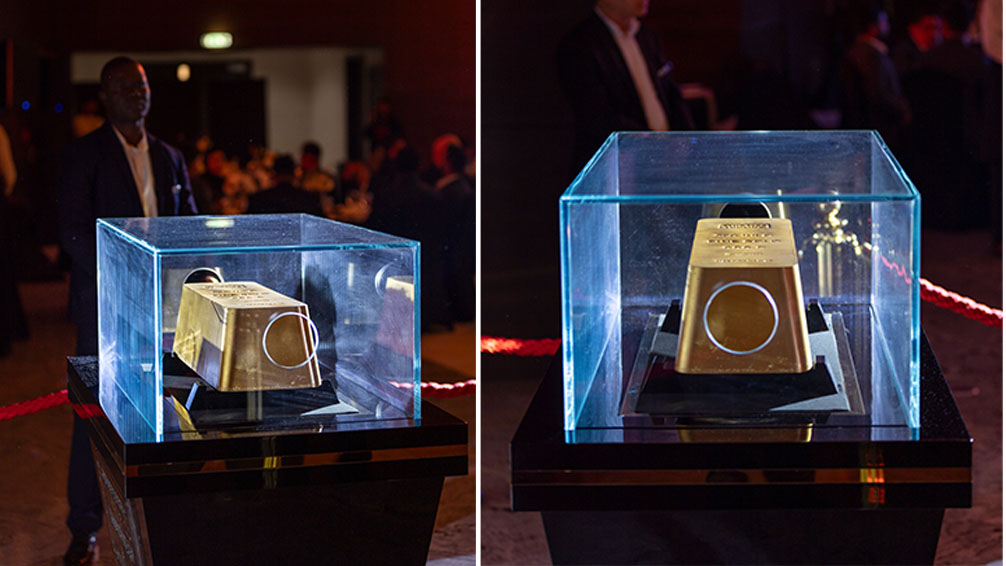 Split image of the largest bar of gold in the world