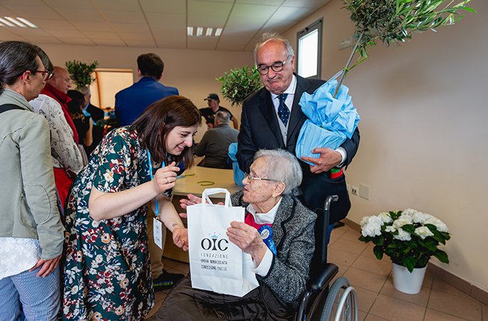 a-centenarian-participant-being-given-a-gift