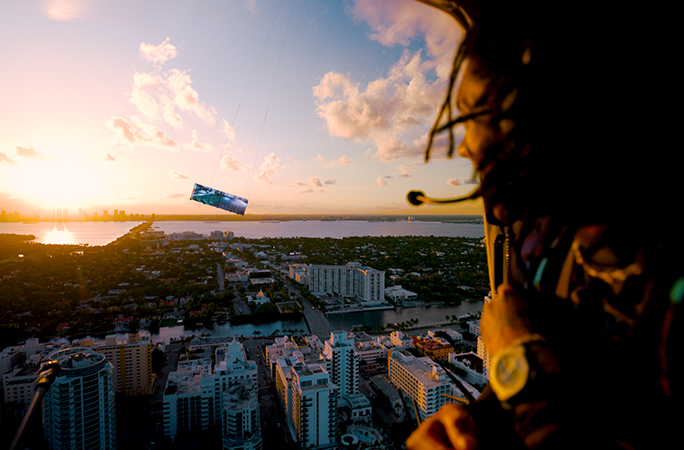 a screen is suspended in the sky amongst the clouds