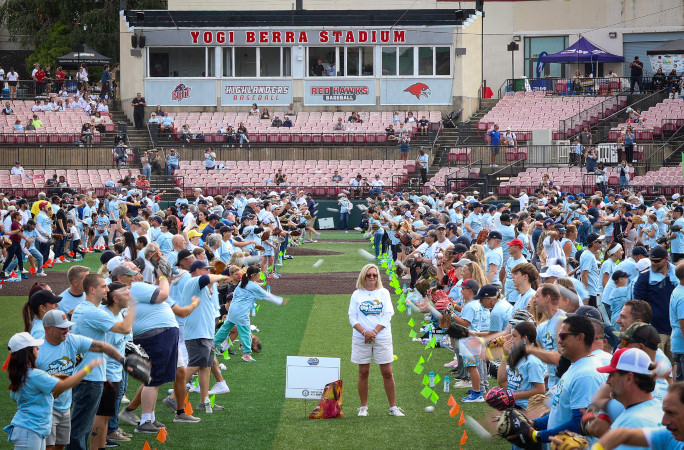 At field level, pairs tossing the baseball