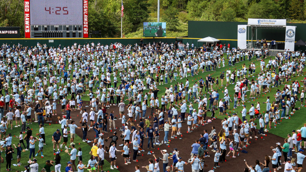 The stadium full of people playing catch