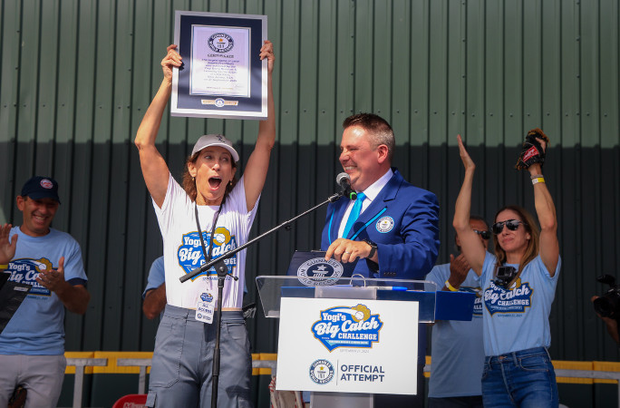 Michael with event organizers giving them the certificate