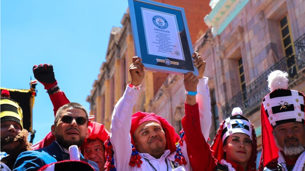 Event organizers holding GWR certificate while in character