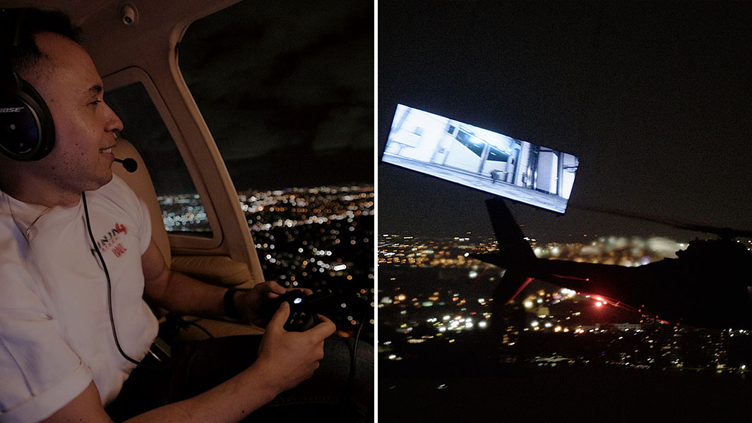 split image of man sitting in helicopter holding a gaming controller and a screen suspended in the air by helicopter