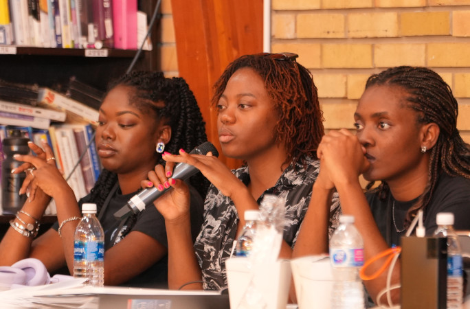 Audience members asking questions