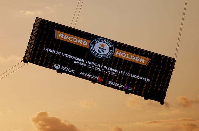 record holder logo is projected on the screen and flown through the air