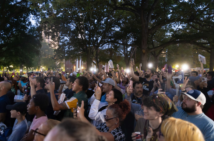 Crowd listening to Thomas's announcement