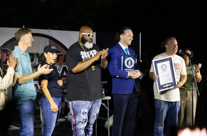 Organizers accepting the certificate onstage