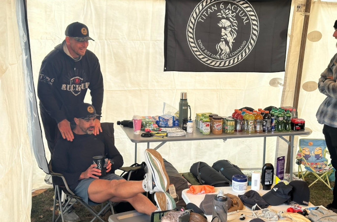 The coach massaging Mark's shoulders