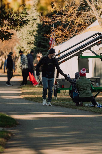 Mark giving a kid a high-five