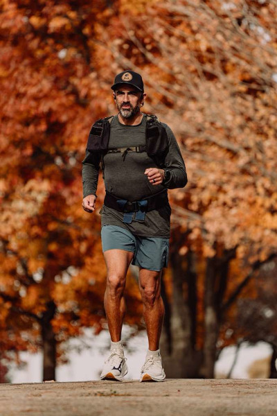 Mark running and looking serious