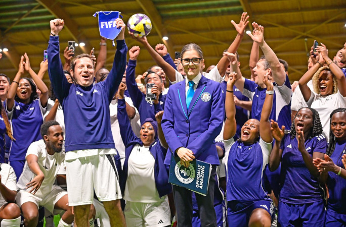 Players raising their FIFA flag