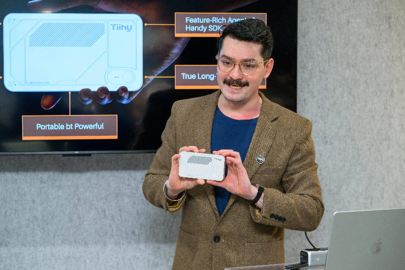 the PC being held by a man