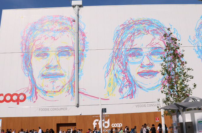 A display of portraits over one another at Expo 2015 Milan