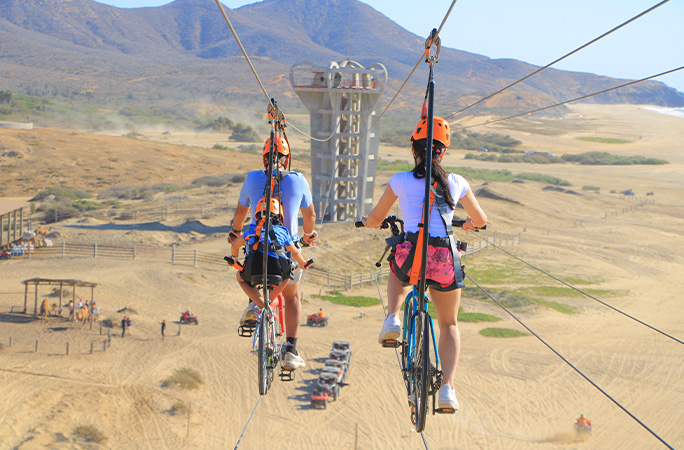 Family riding the bicycle zip wire