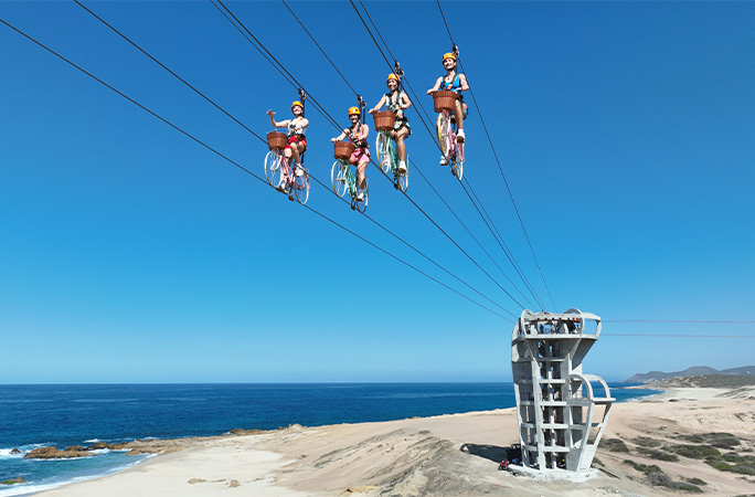 Riders on the longest bicycle zip wire