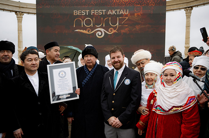 a group of people are awarded with a guinness world records certificate