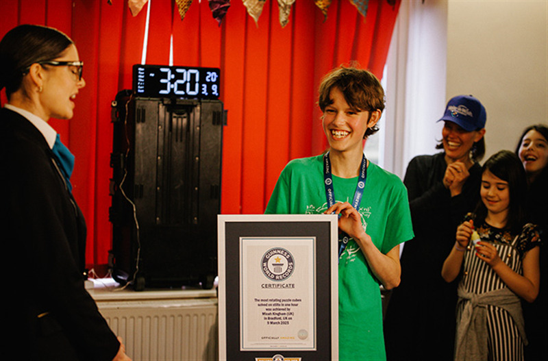 micah is presented with this guinness world records certificate