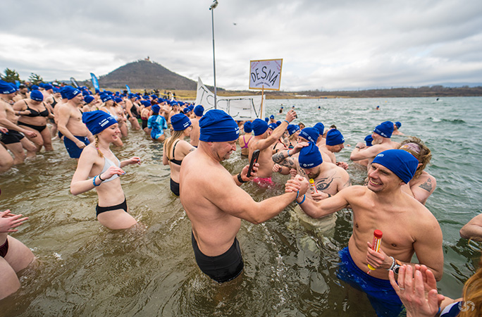 participants smile and high five each other while in lake most