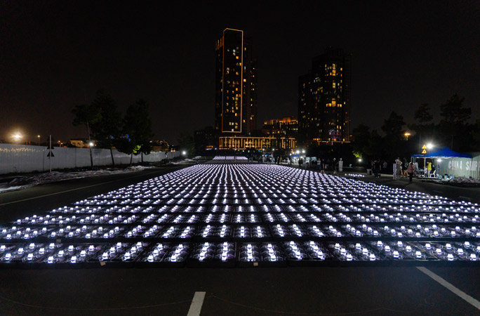 Lit drones standing by