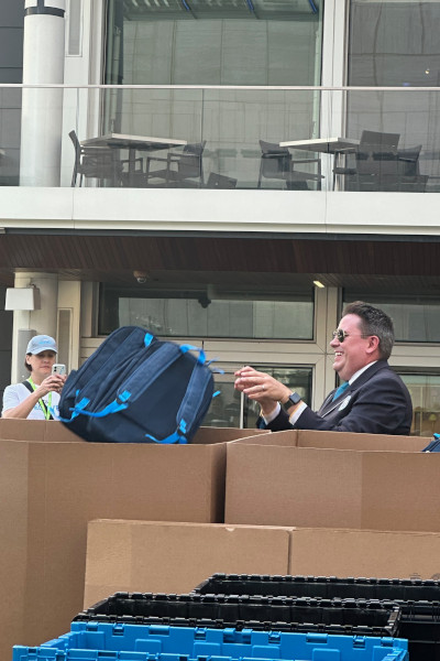 Adjudicator throwing the bags in bins