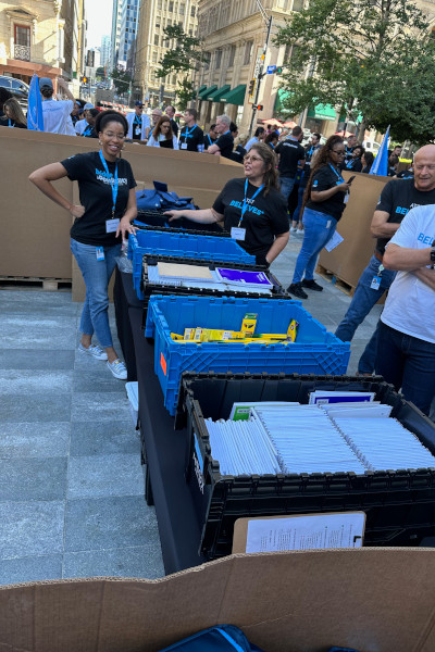 Employees smiling with supplies