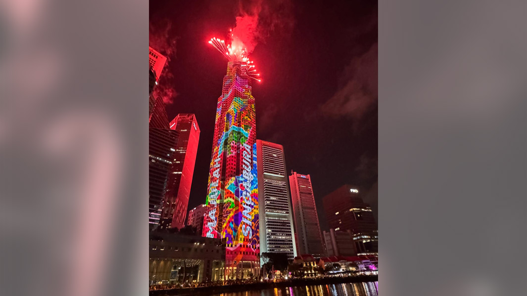Projection mapping on the UOB Plaza One building with fireworks