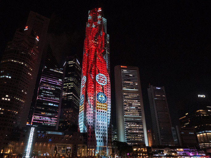 UOB Plaza One being lit for SG60 with recordholder logo