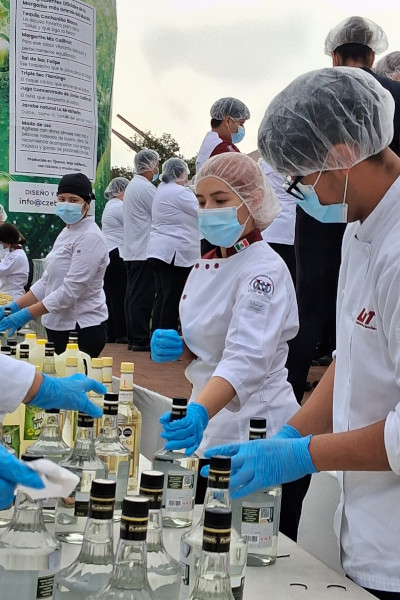 Chefs handling the bottles