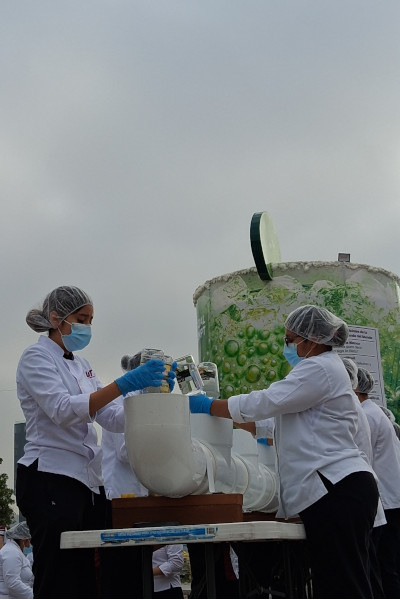 Tank being filled by volunteers