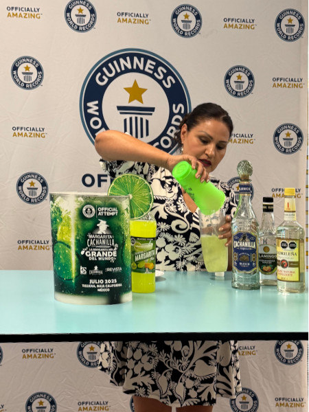 Faviola pouring the margarita