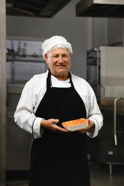 Chef holding a lasagne