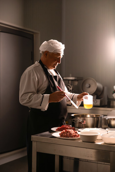 Chef making the lasagne