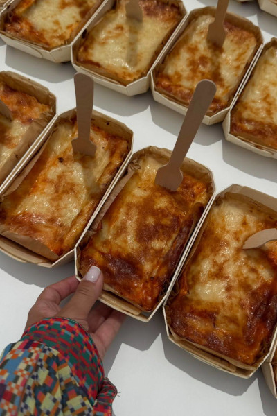 Taking a lasagne from the line