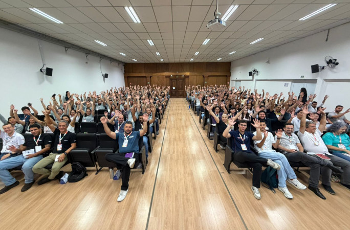 The full audience with their hands in the air