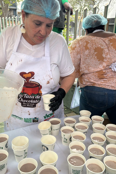 Workers pouring the drinks into cups