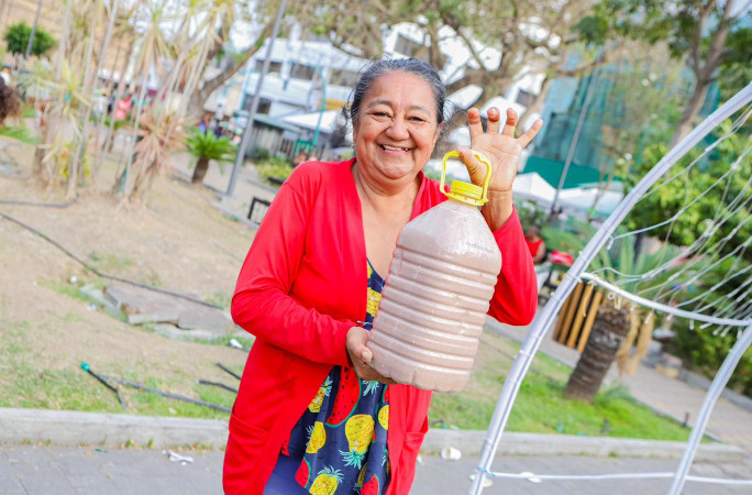 Woman holding a jug of chocolate