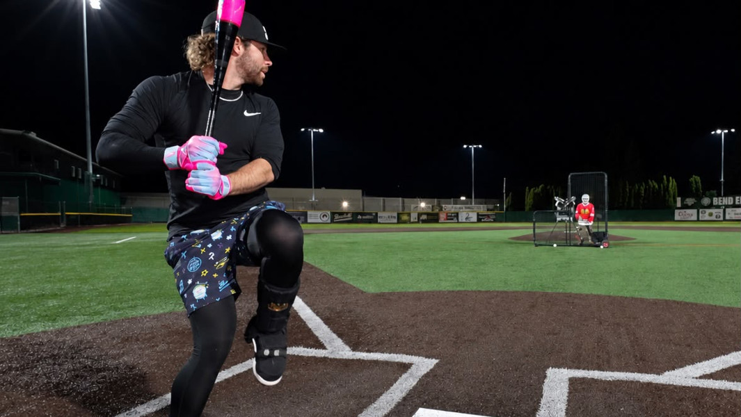 Will Taylor preparing to hit a baseball on field