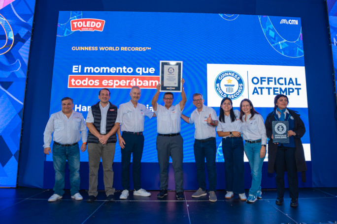 Man and the other organizers holding up the GWR certificate onstage
