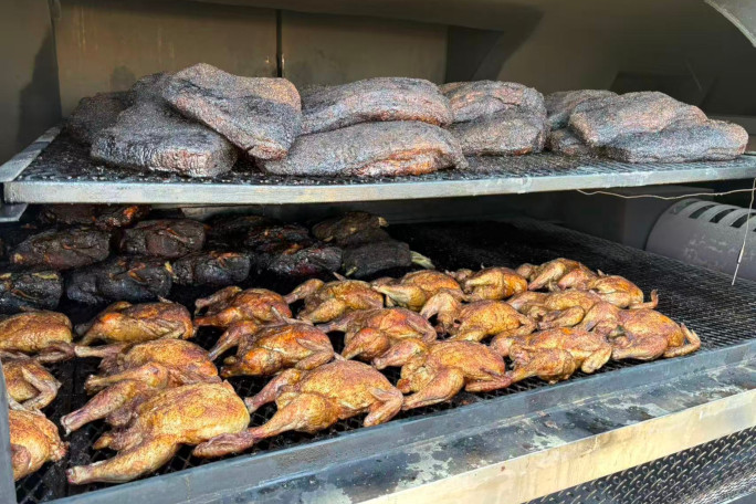 Closeup of the smoker cooking chickens