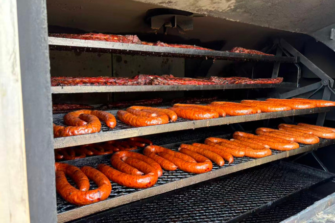 Closeup of the meats being smoked on the truck