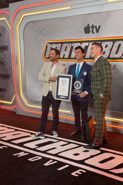 John Cena, the Matchbox stunt driver, and GWR Adjudicator on the premiere carpet