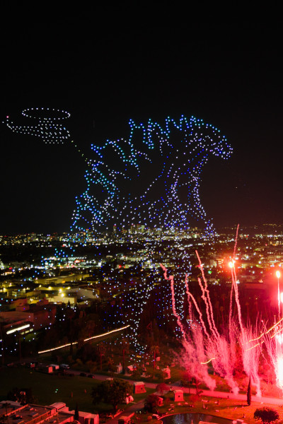 Drone Godzilla with a pyrotechnic display and the Apple TV logo