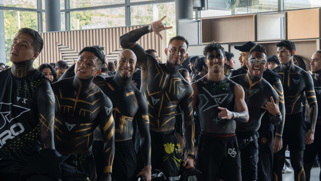 People waiting in line while covered in body paint