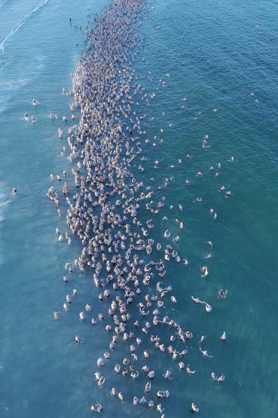 Vertical shot of people in the water