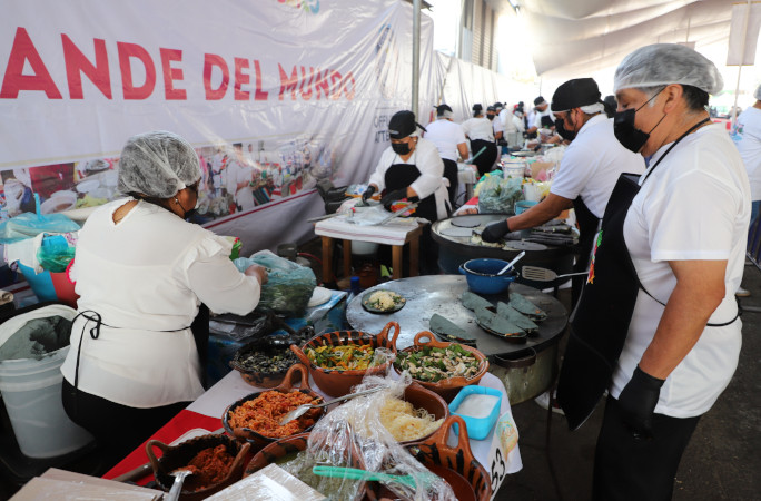 Chefs cooking quesadillas on comales